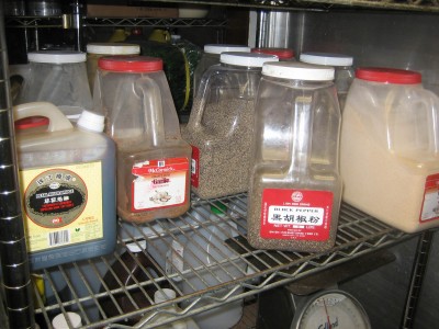 Bulk spice storage of Lian How products at a restaurant.