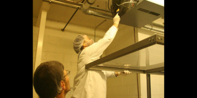 Epidemiologists swab ceiling vents as they search for clues about whether Salmonella is contaminating this milk product.