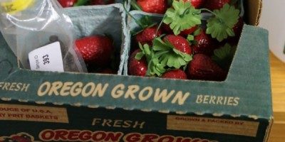 A box of berry-stand strawberries.