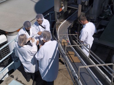 Epidemiologists track specimens in a log as they are collected.